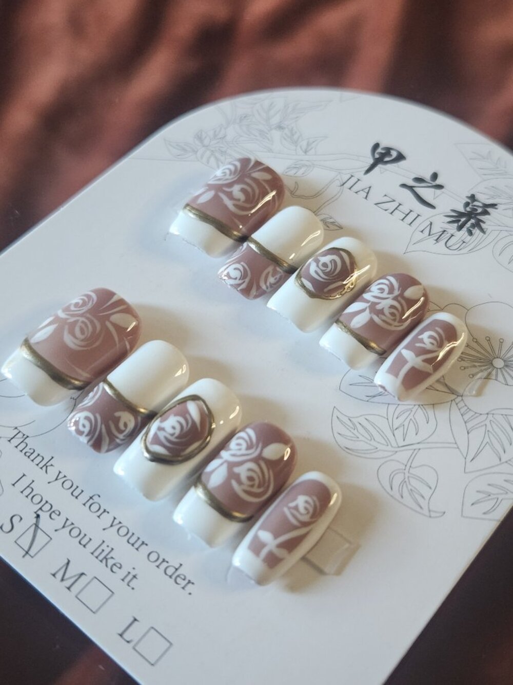 Jia Zhi Mu short 2.0 square nude, white & gold french tip floral press on nails.